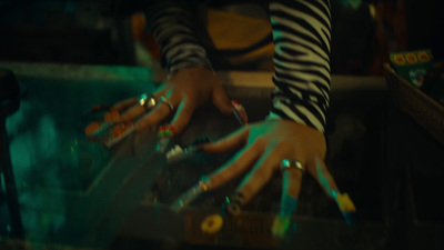 a close up of a person's hands with nail polish