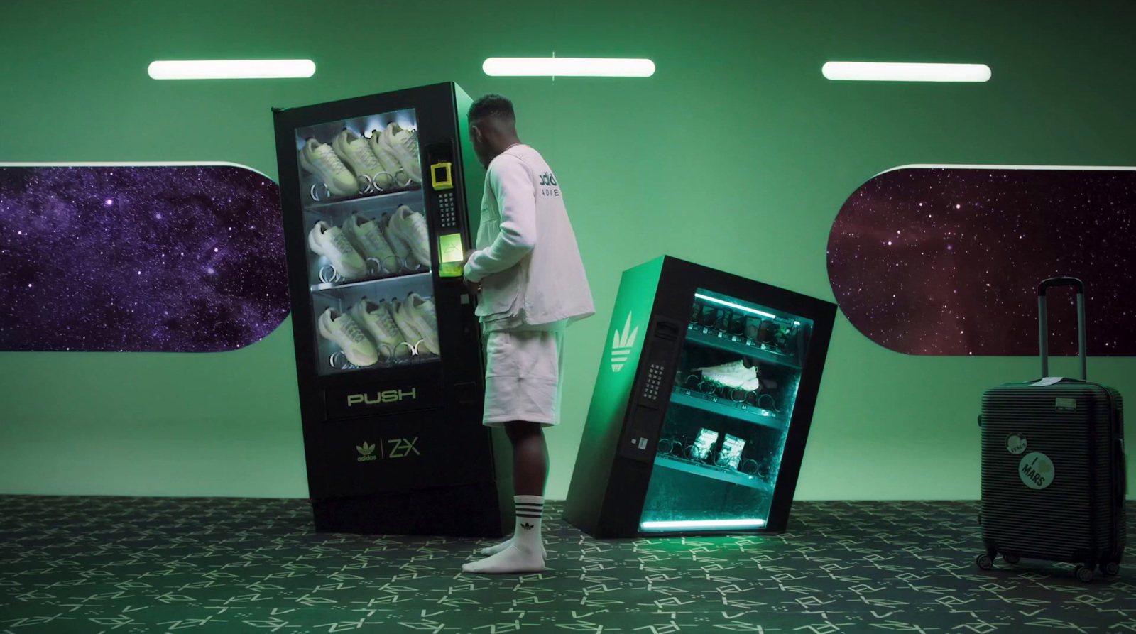 a man standing in front of a vending machine