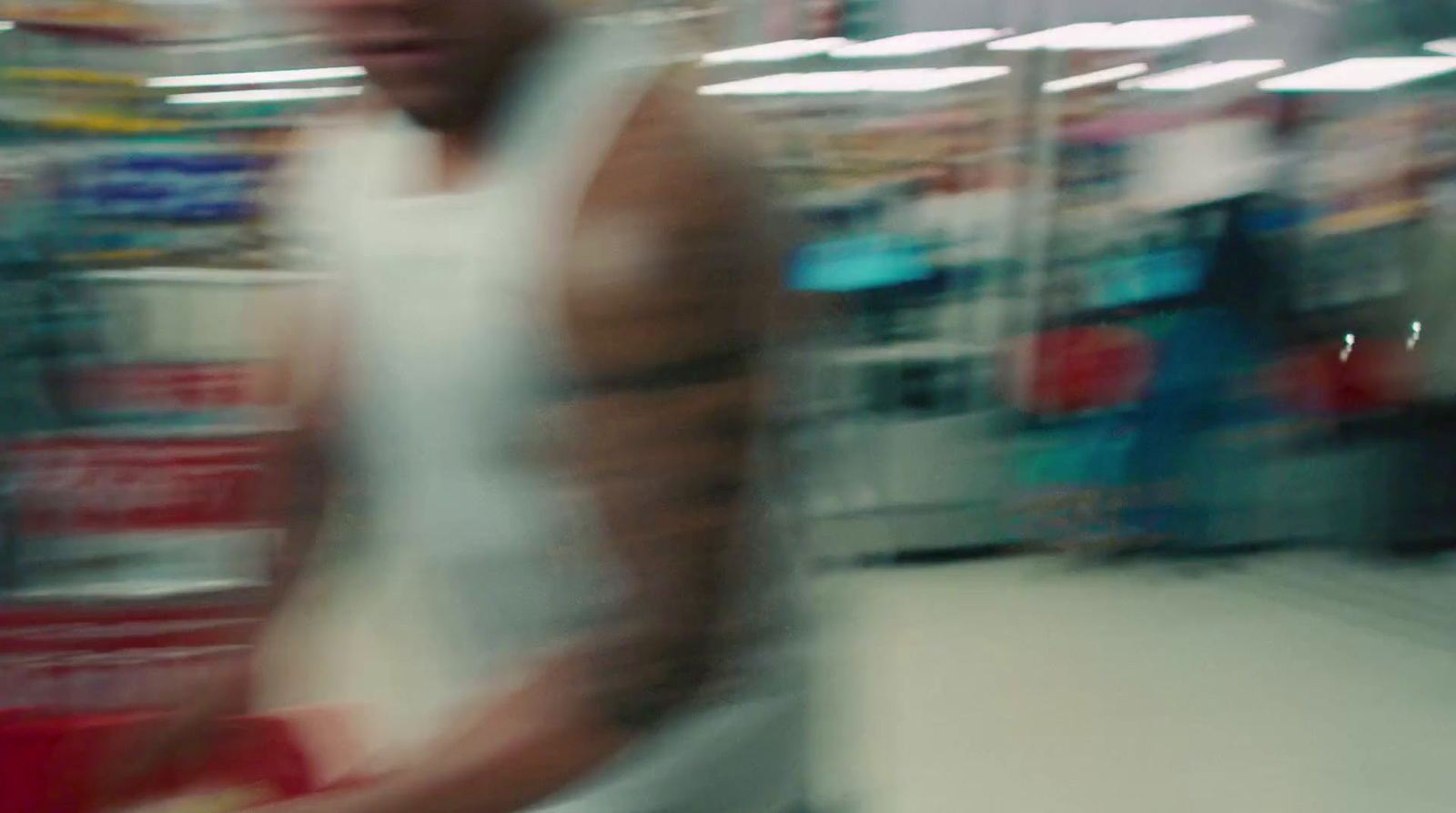 a blurry photo of a man in a store