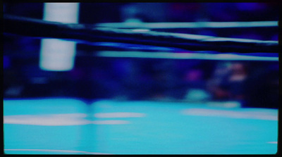 a blurry photo of a boxing ring