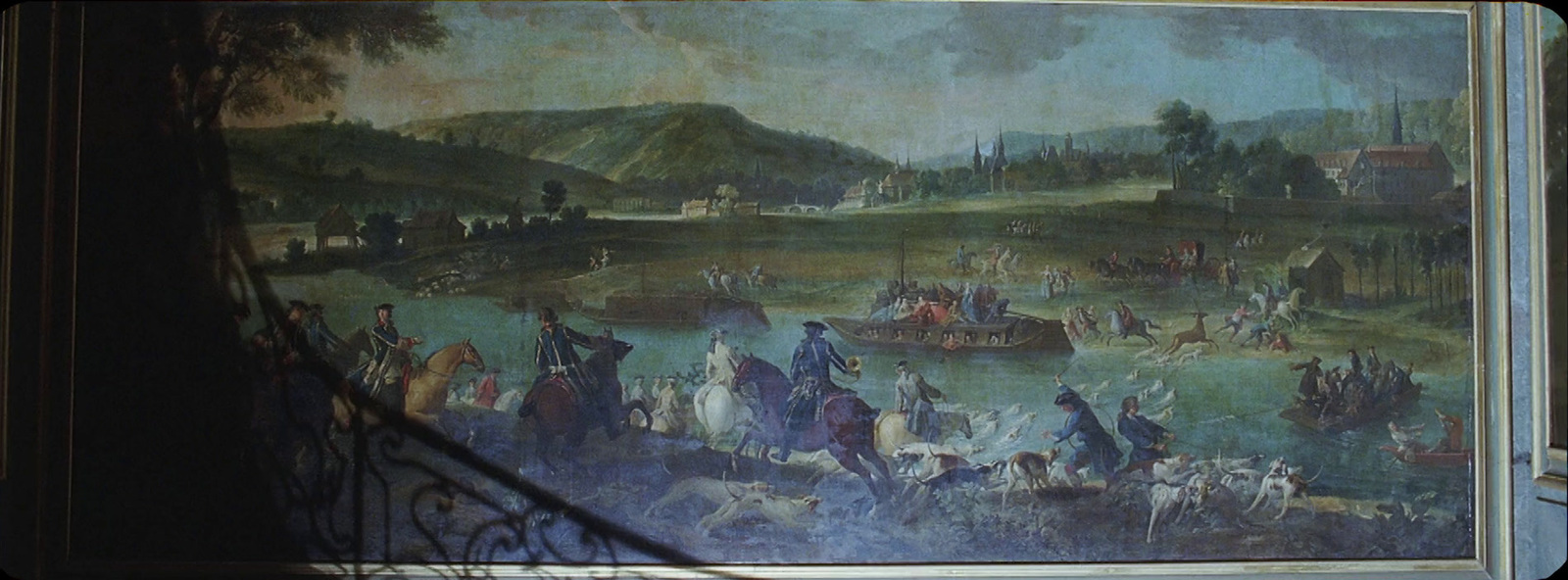 a painting on a wall of people and animals