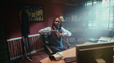 a man sitting at a desk in front of a computer