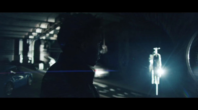 a man standing next to a car at night