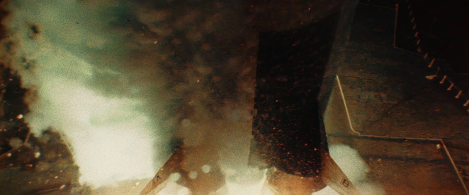 a man standing in front of a bunch of smoke