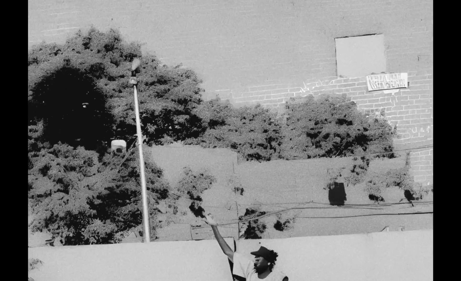 a man holding a tennis racquet on top of a tennis court