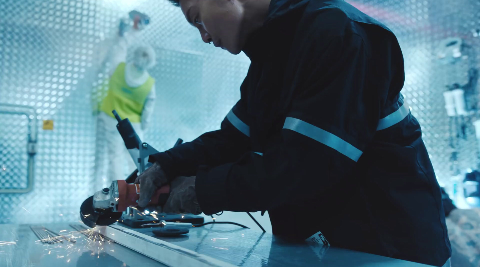 a man working on a piece of metal