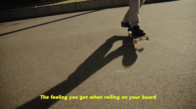 a person riding a skateboard down a street