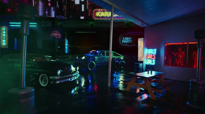 a car parked in a garage with neon lights