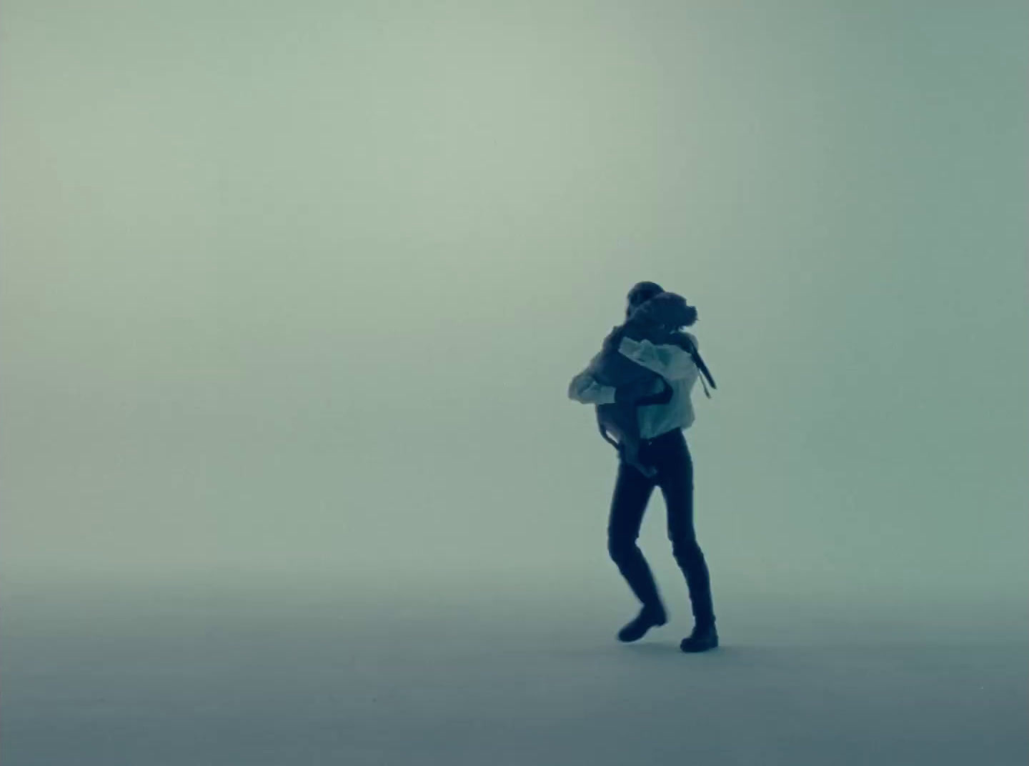 a person with a backpack in a foggy area