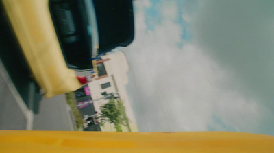 a view from a vehicle looking up at a building