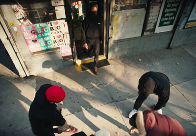 a group of people standing on a sidewalk