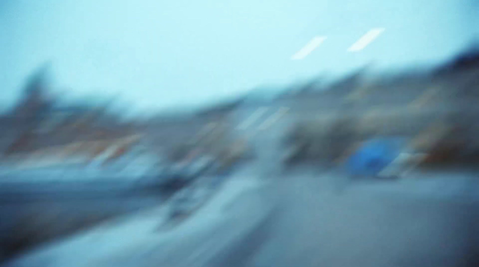 a blurry photo of a person riding a bike