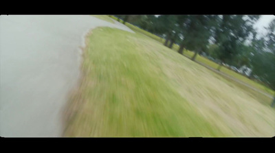 a blurry photo of a person riding a skateboard down a hill