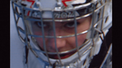 a close up of a hockey goalie's helmet