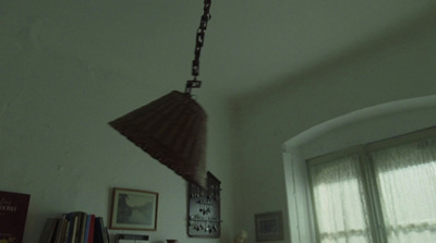 a lamp hanging from a ceiling in a room