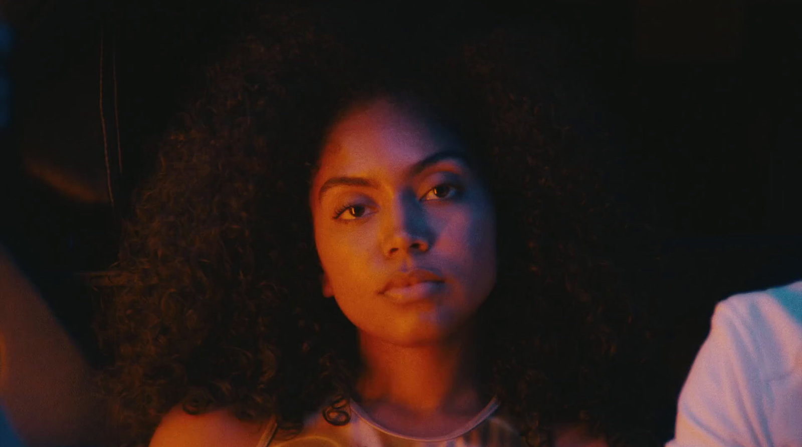 a close up of a person with curly hair