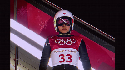 a person in a ski suit and goggles