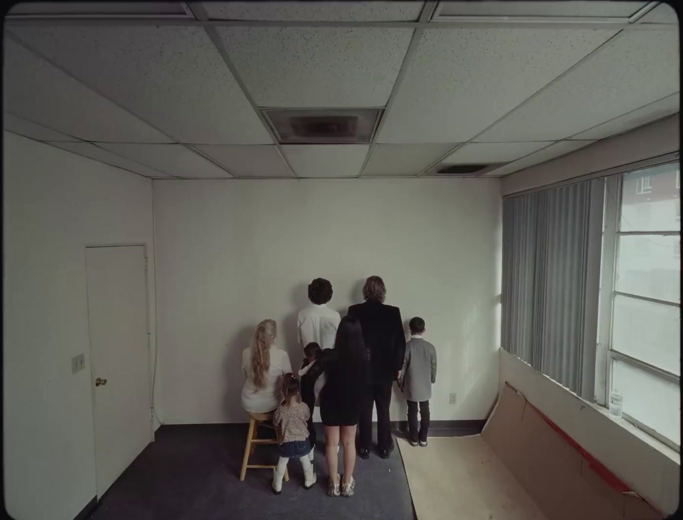 a group of people standing in a room