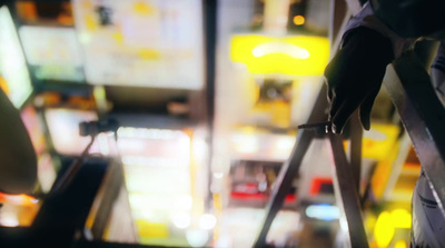 a blurry photo of a person holding a ladder