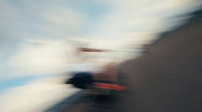 a blurry photo of a person riding a skateboard