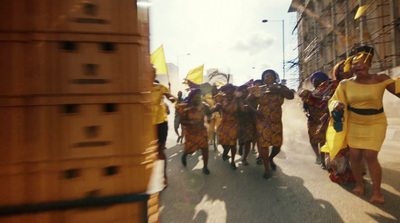 a group of women walking down a street