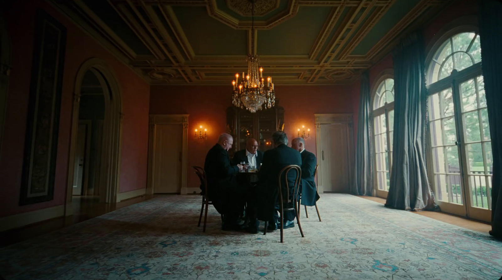 a group of people sitting around a table in a room