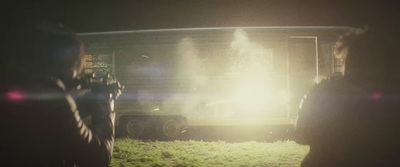 a group of people standing in front of a truck