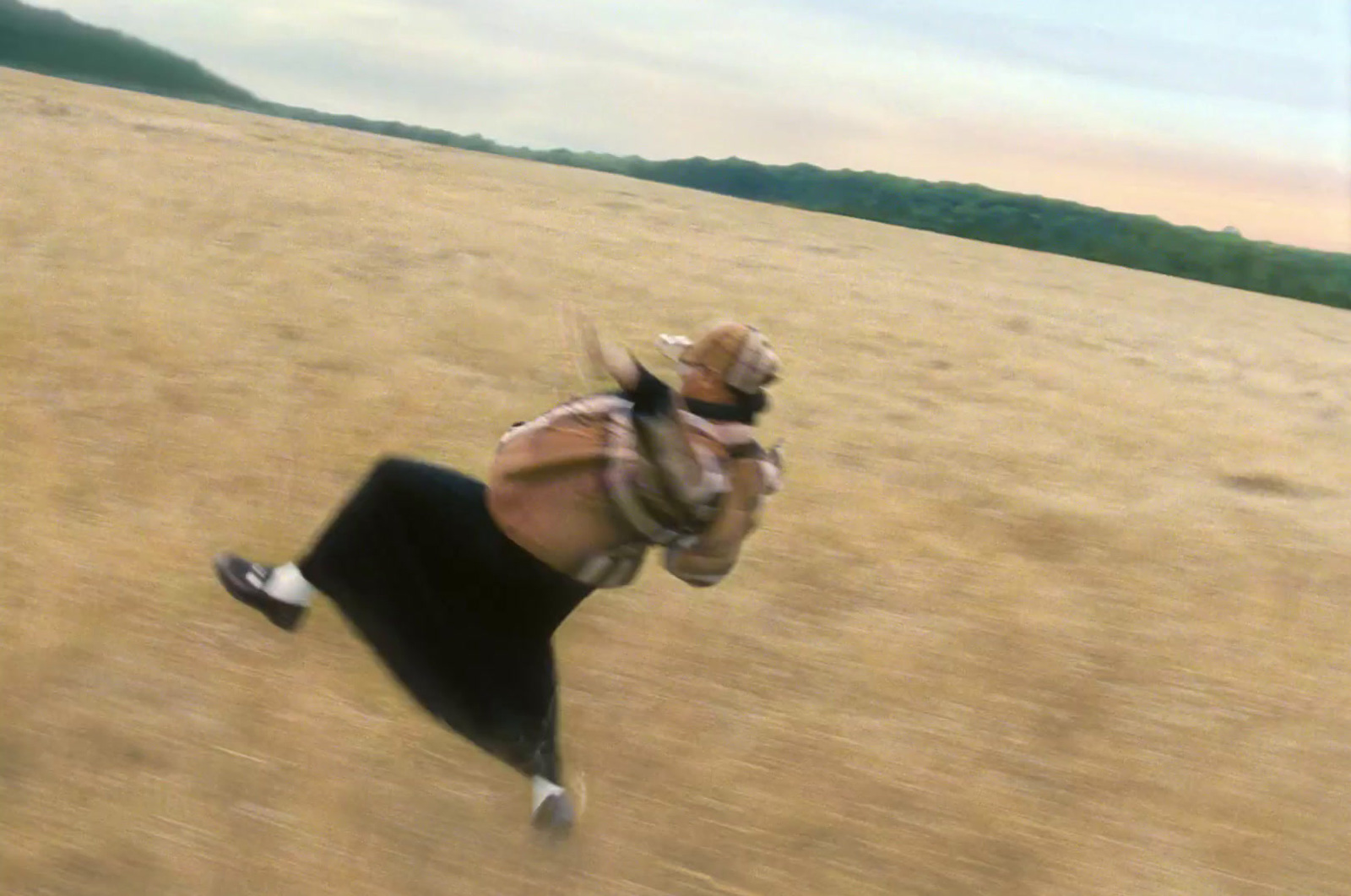 a blurry photo of a person running in a field