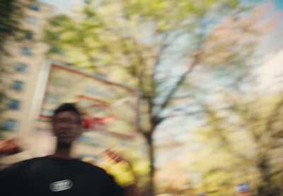 a blurry photo of a man holding a frisbee