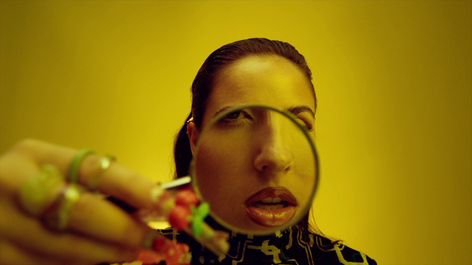 a woman looking through a magnifying glass