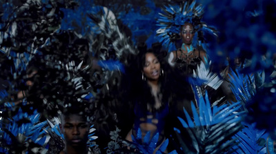 a group of people standing in front of a blue background