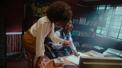 a man and a woman sitting at a desk