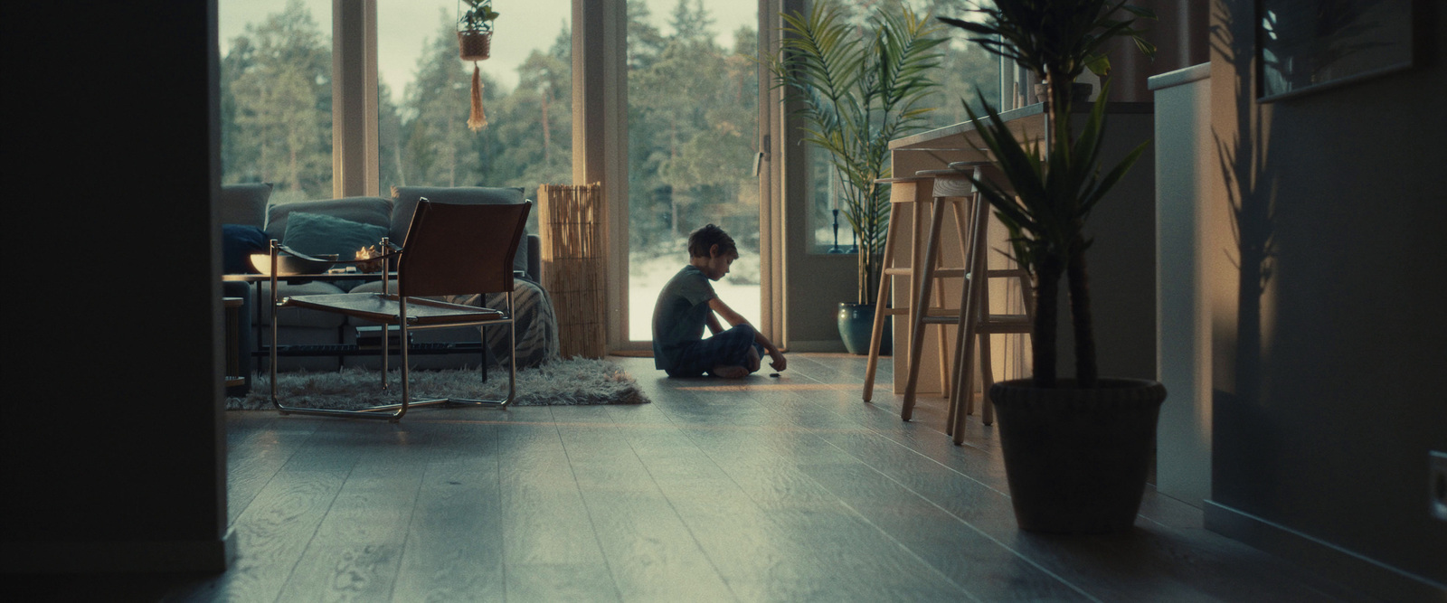 a person sitting on the floor in front of a window