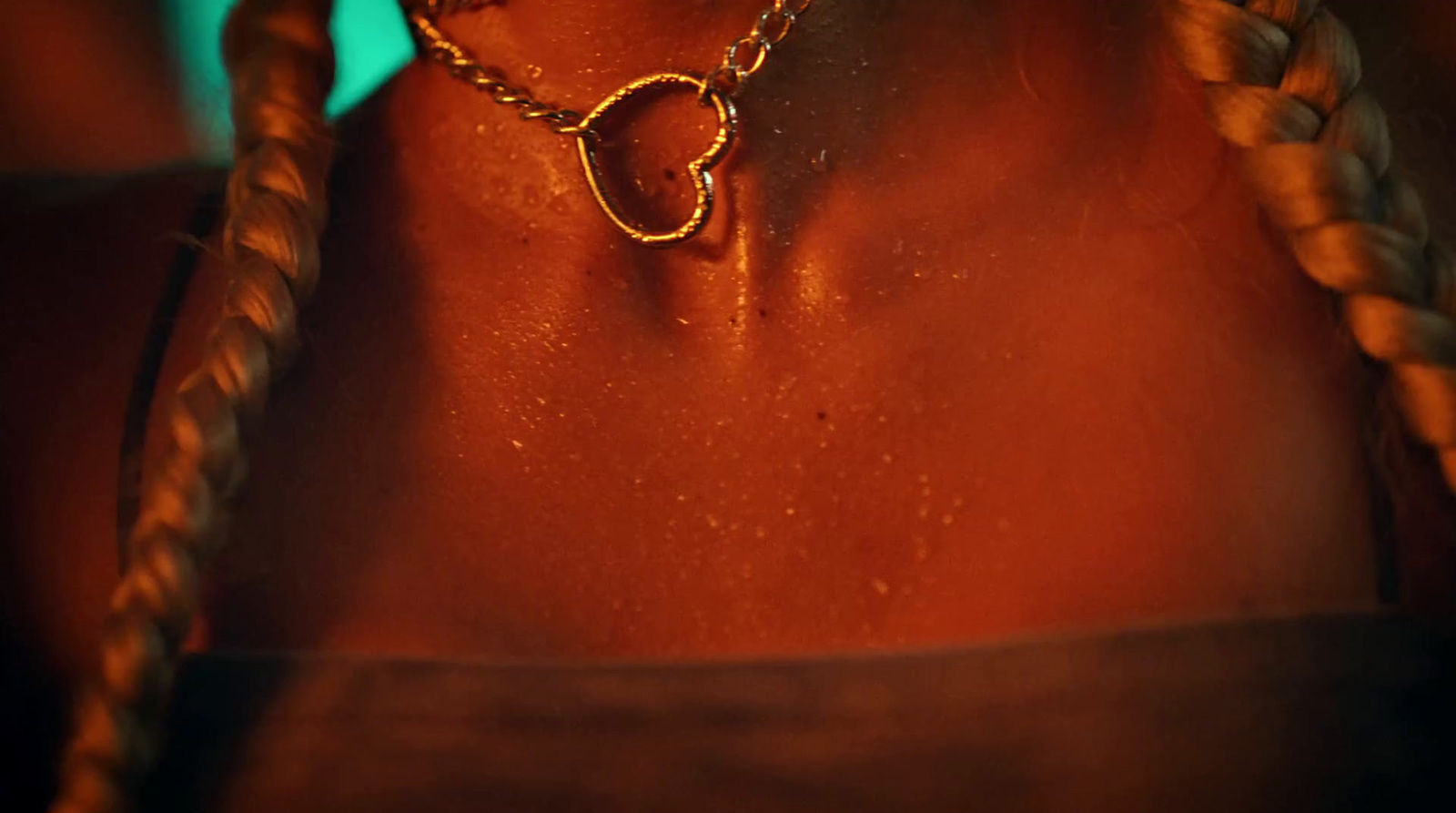 a close up of a person wearing a necklace