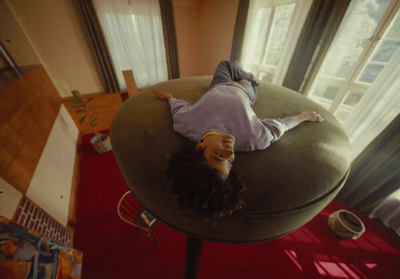 a person laying on a chair in a room