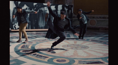 a group of men standing on top of a marble floor