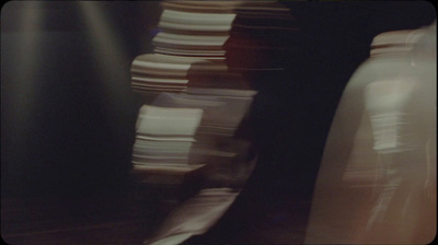 a stack of white plates sitting on top of a table