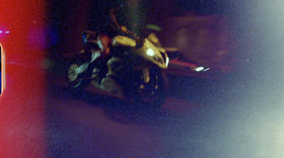 a blurry photo of a motorcycle on a street