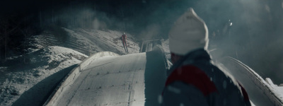 a person standing on a snow covered slope