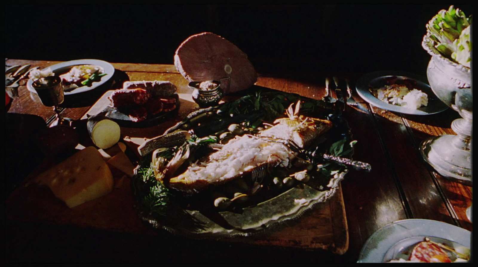 a wooden table topped with plates of food