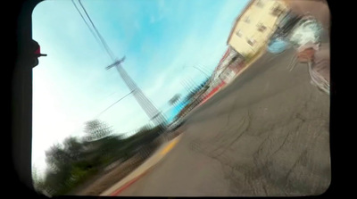 a blurry photo of a street with a stop sign