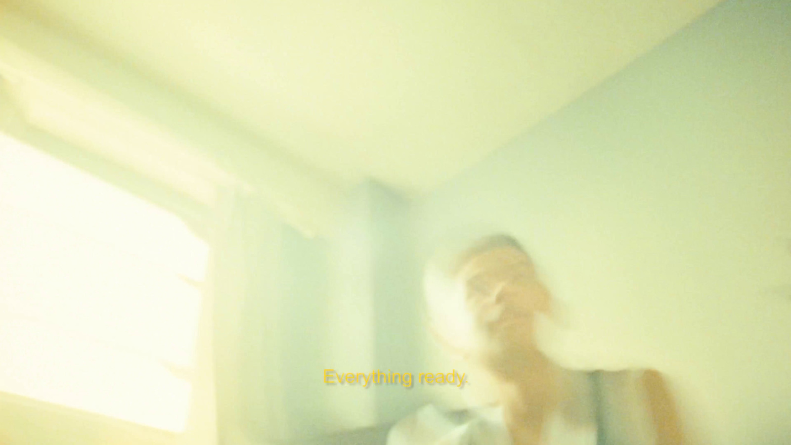 a blurry photo of a person standing in a room