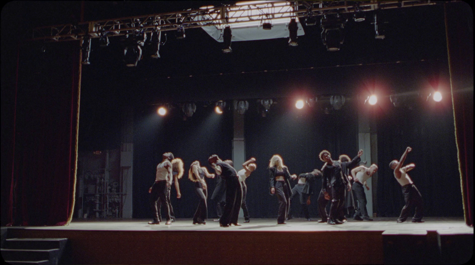 a group of people standing on top of a stage