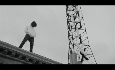 a person standing on top of a building