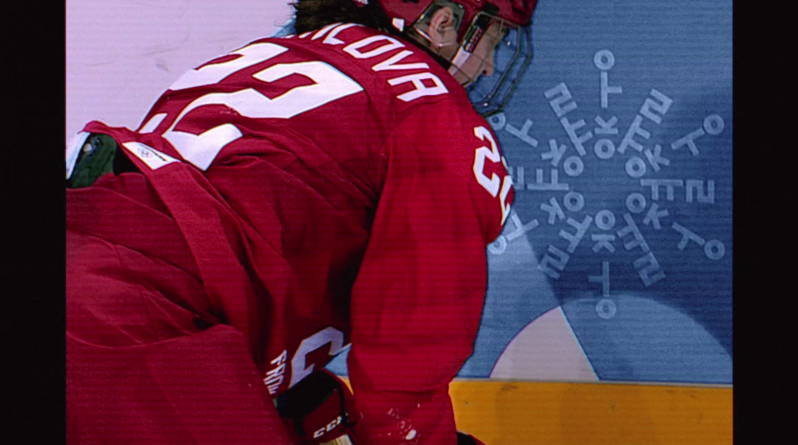 a hockey player with a red uniform and helmet on