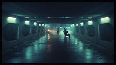 a group of people walking through a tunnel