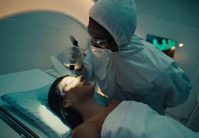 a woman getting a facial peel from a doctor