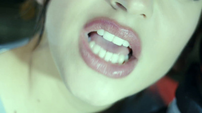 a close up of a person with their mouth open