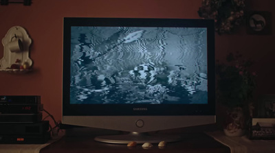 a computer monitor sitting on top of a desk