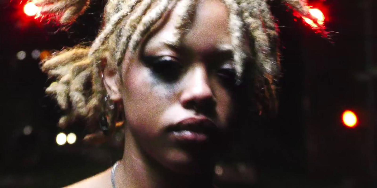 a close up of a person with dreadlocks